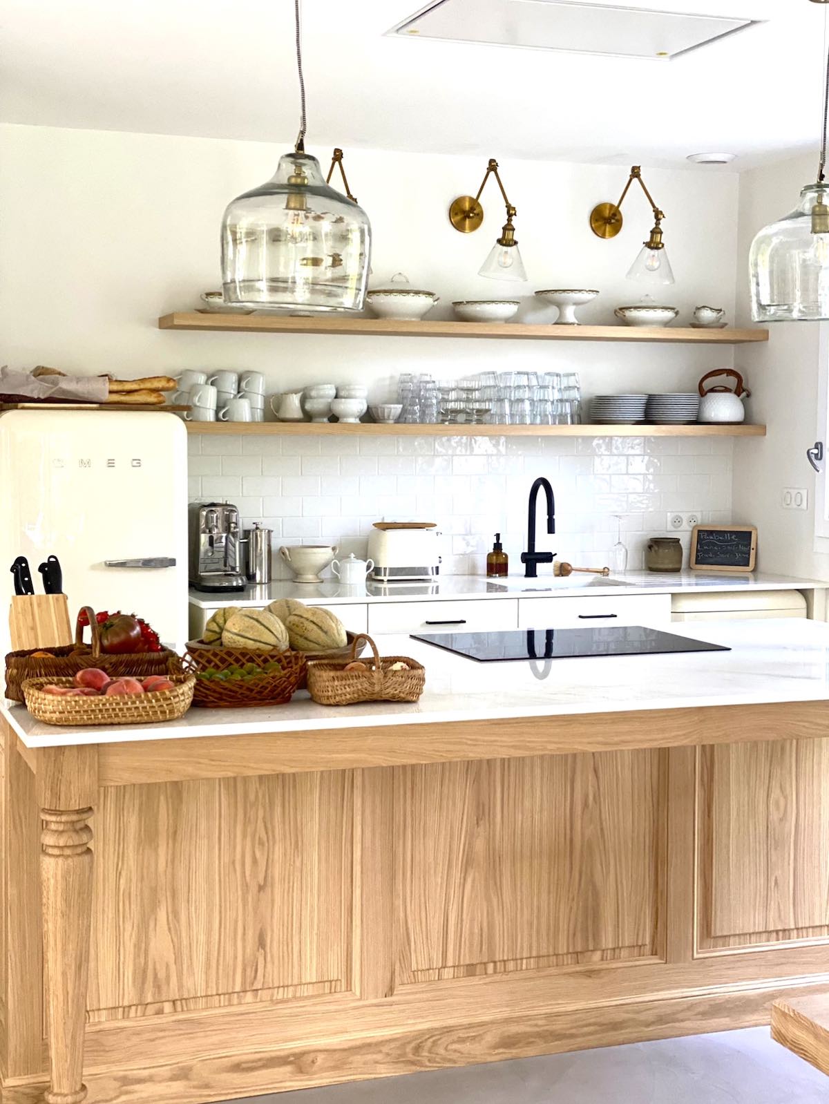 Bight Kitchen with wooden Island at Maison Coli