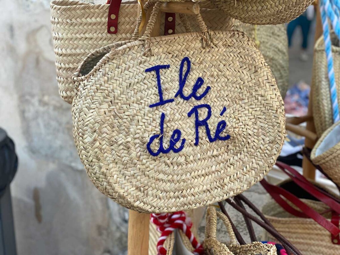 A straw bag that reads Ile de Re